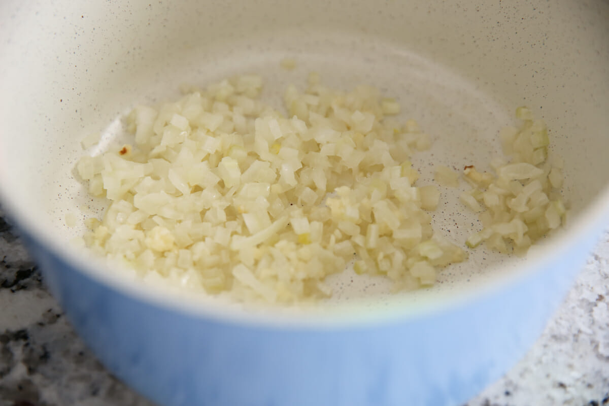 Diced onions in a pot on the stove