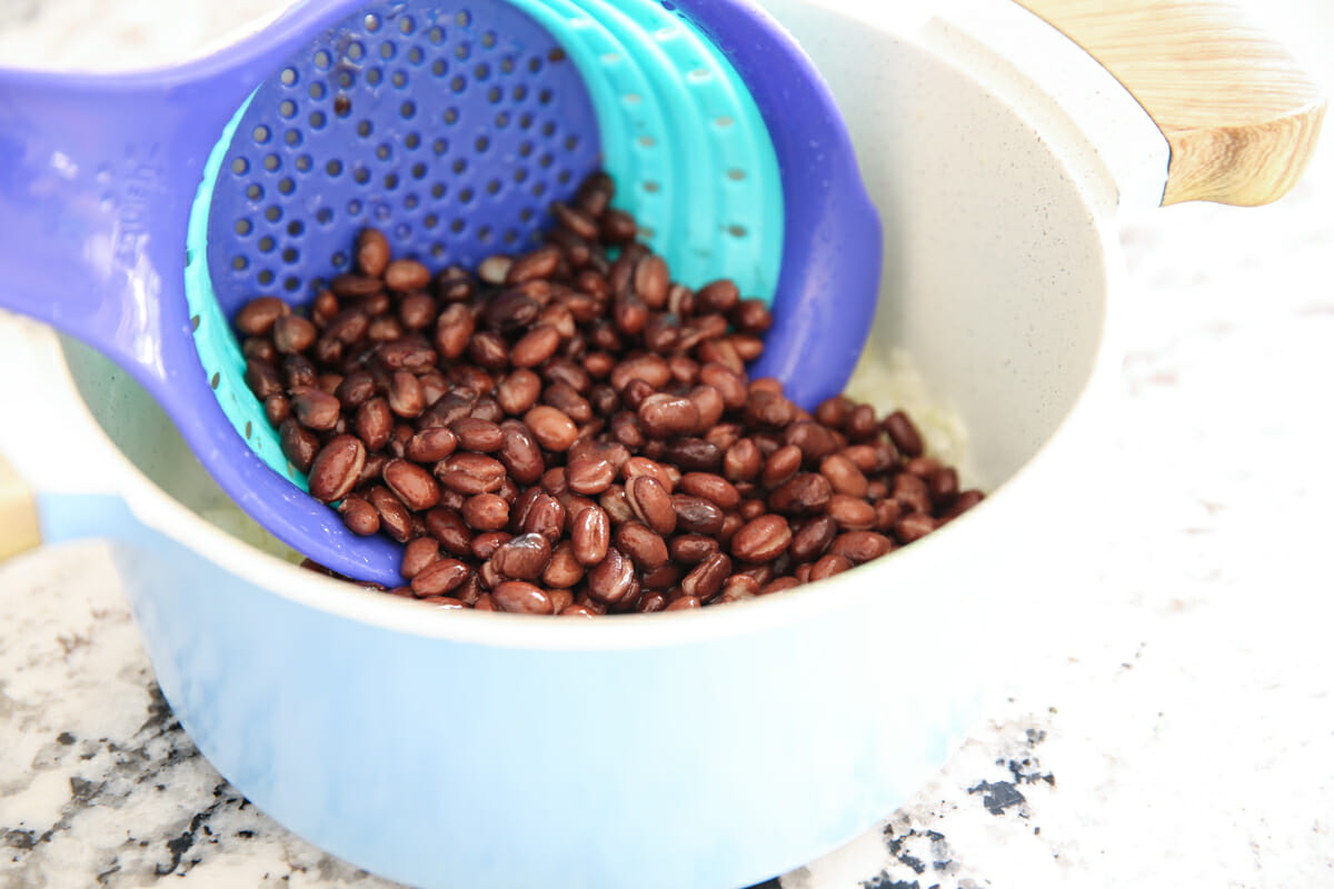 Drained, rinsed black beans in a strainer