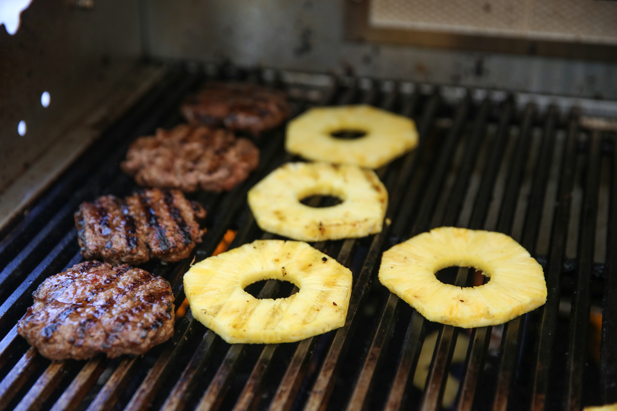 grilling burgers and pineapple