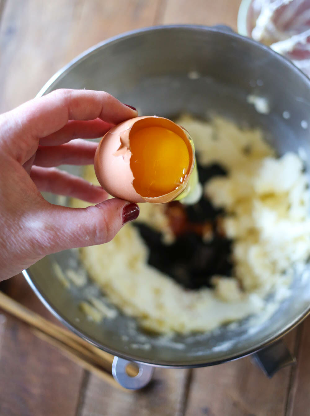 adding egg to ginger spice cookies