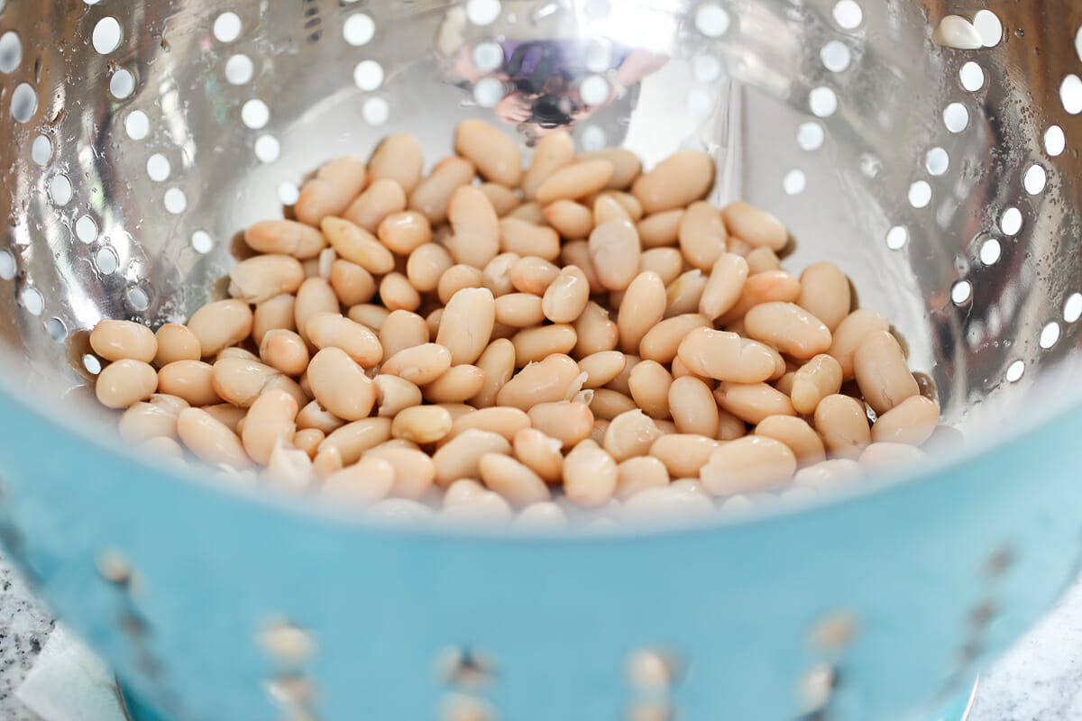 white beans in a strainer