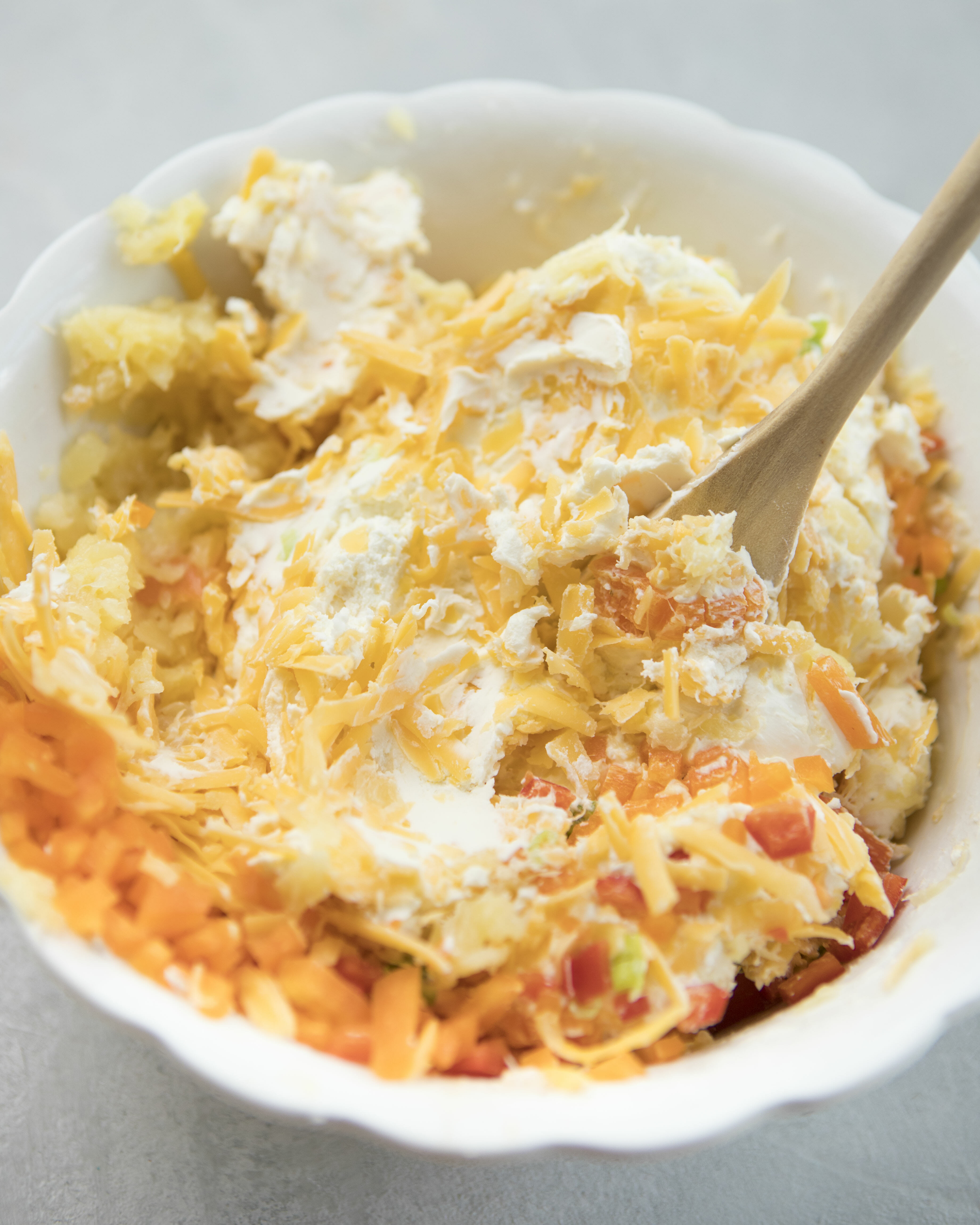 Mixing perfect cheeseball ingredients 