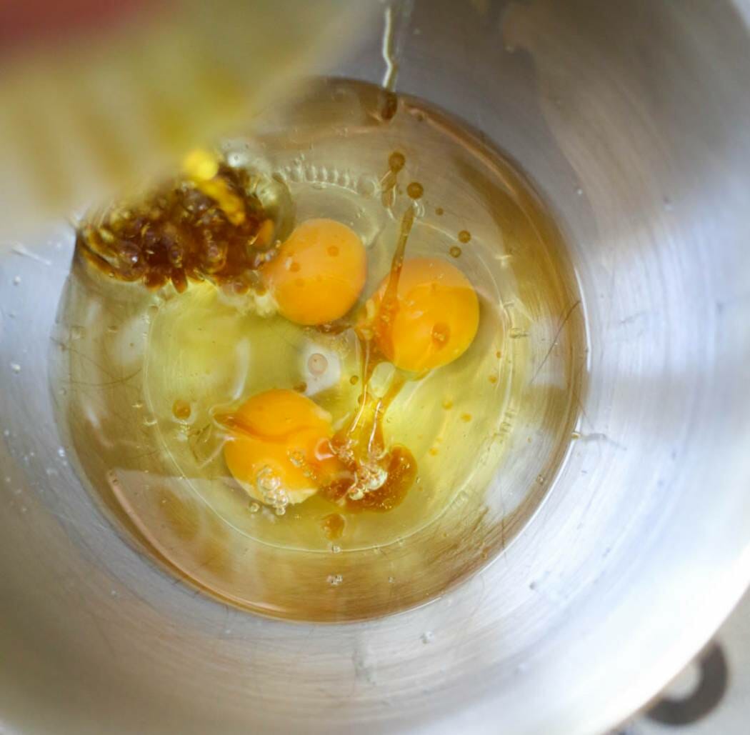 adding oil to eggs and extracts
