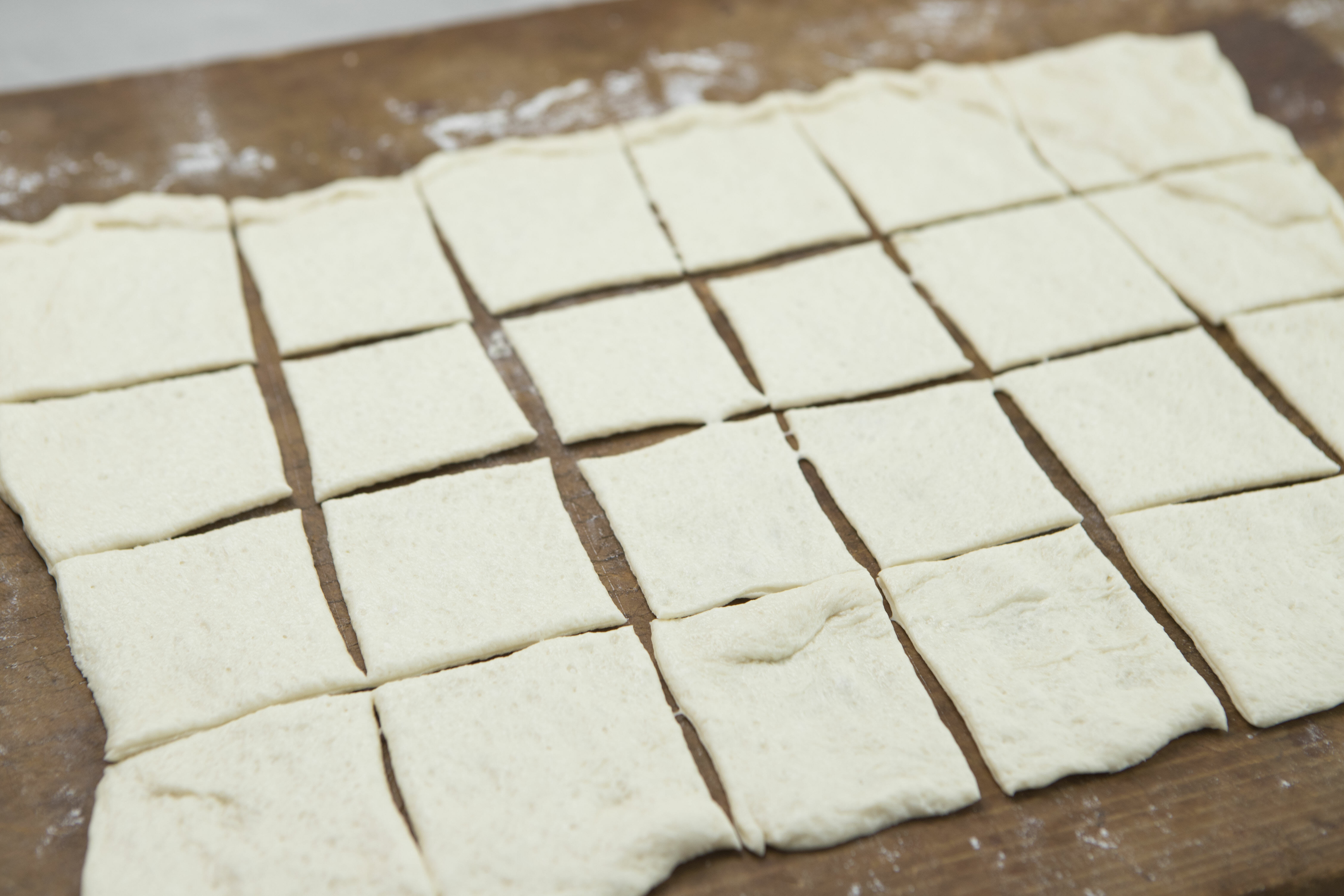 pizza dough cut into squares