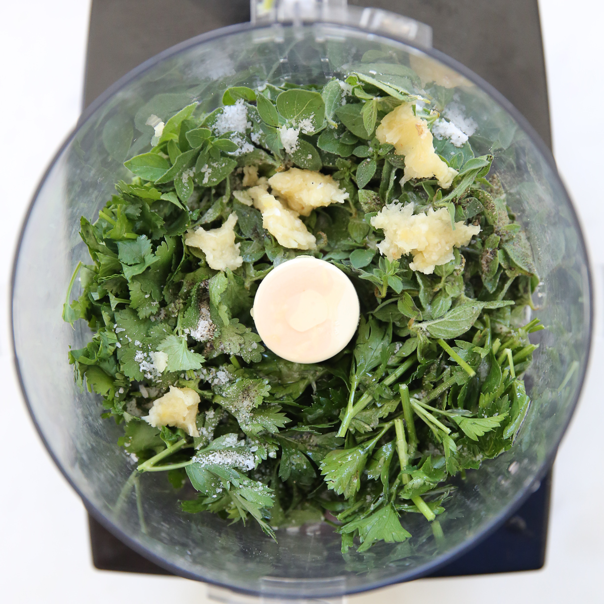 chimichurri ingredients in a food processor