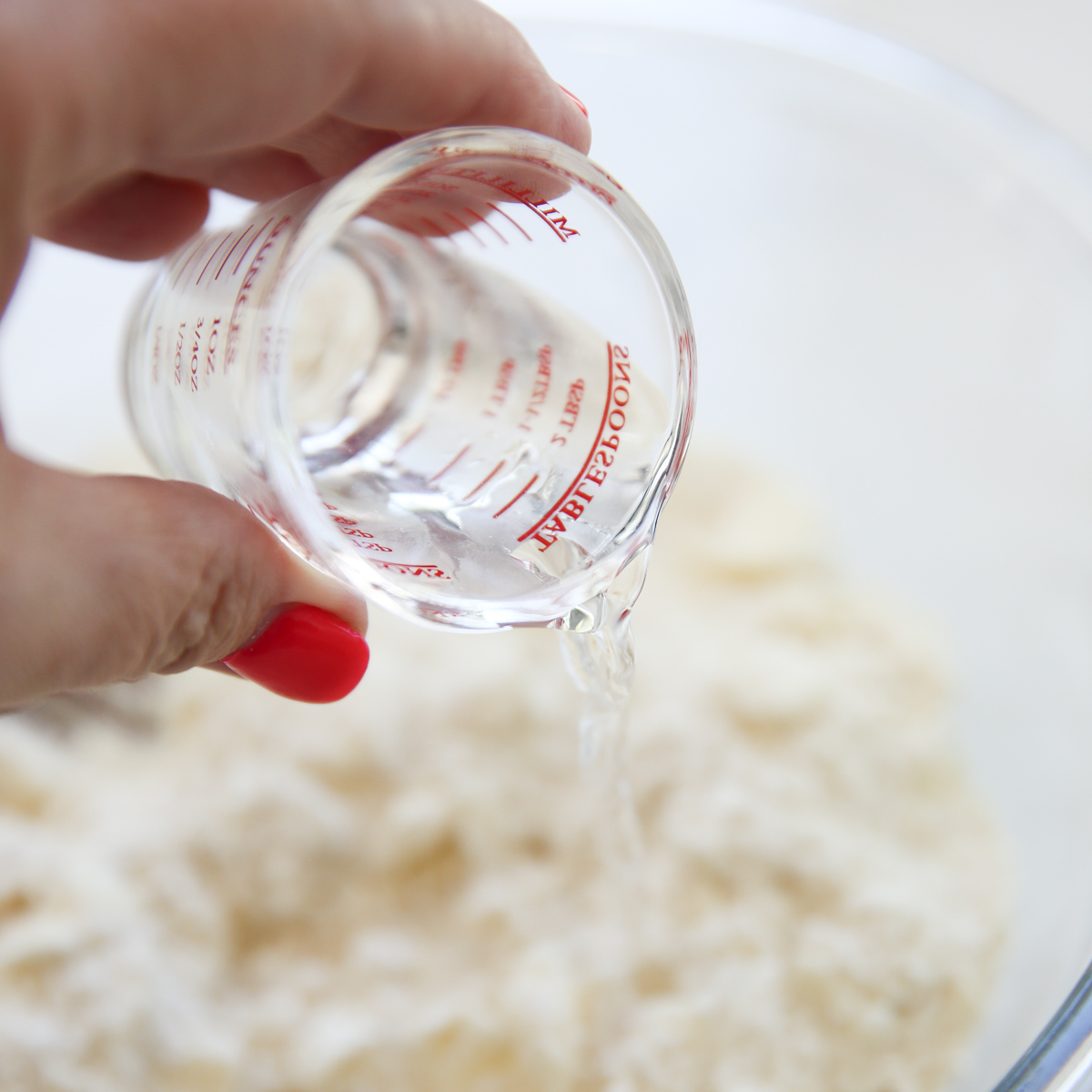 making pie dough in a glass bowl
