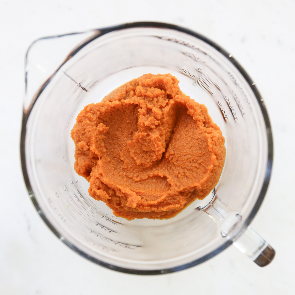 canned pumpkin in a mixing bowl