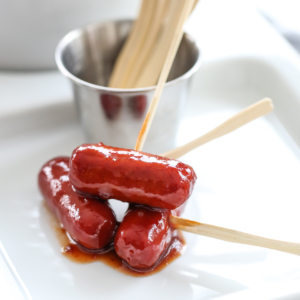 sweet and sour little smokies on a plate