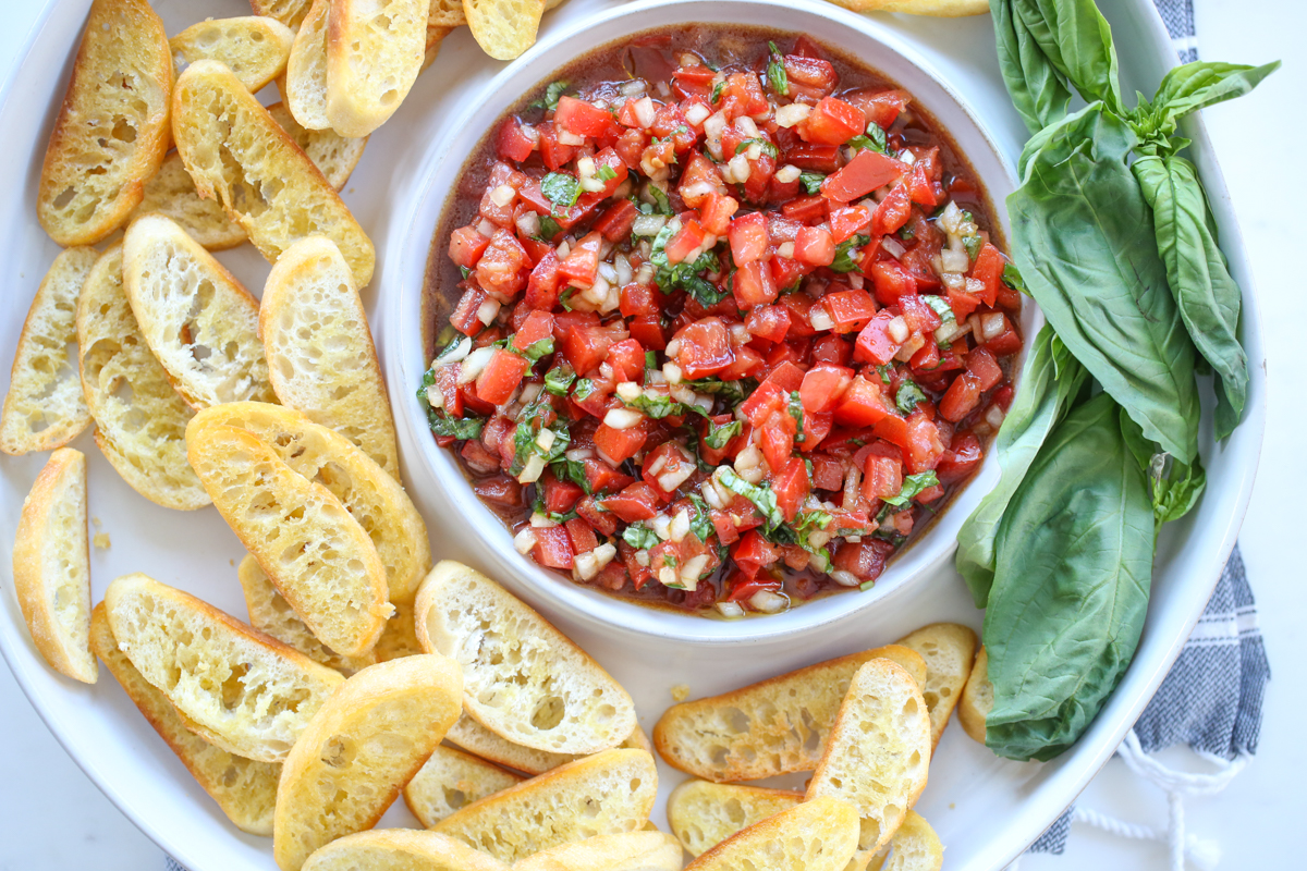 bruschetta in a serving dish with crostini