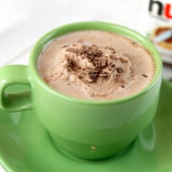A green mug filled with gourmet Nutella hot cocoa.