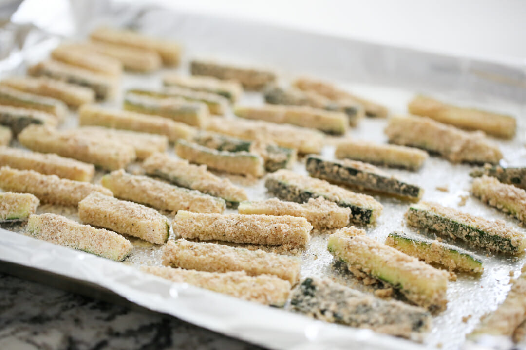 Zucchini Fries ready for baking on pan