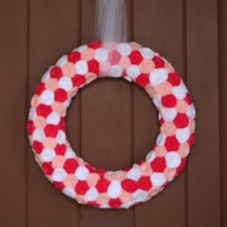 A Valentine's wreath made with felt rosettes.