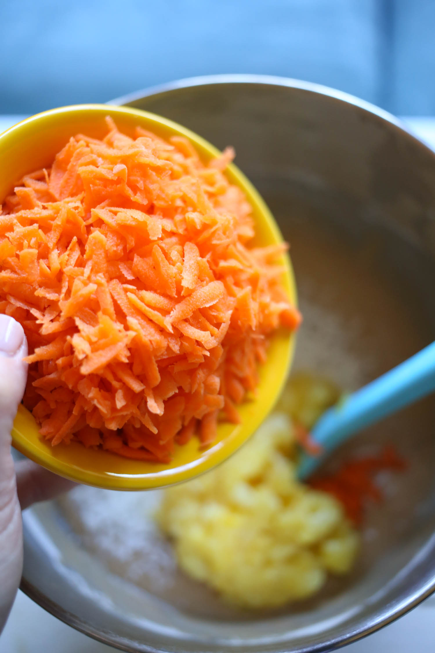 adding carrots to carrot cake