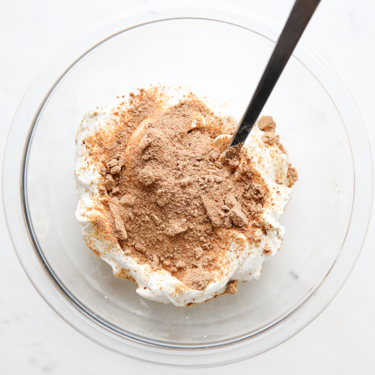 mixing taco seasoning with sour cream