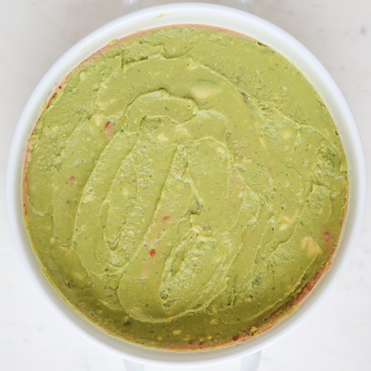 guacamole in a round dish