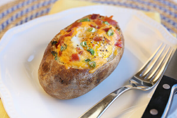 egg stuffed baked potato on plate