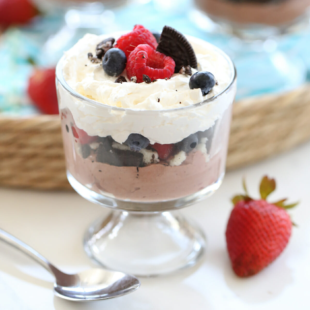 layered cream, berries and chocolate Pudding in bowl