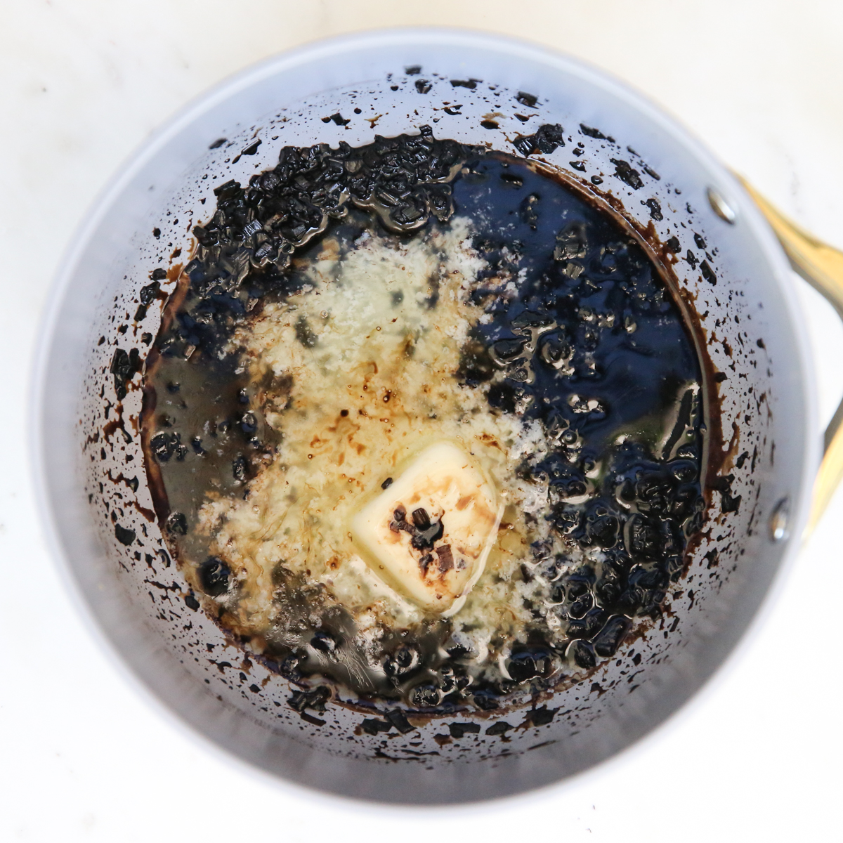 balsamic and butter reduction in a sauce pan