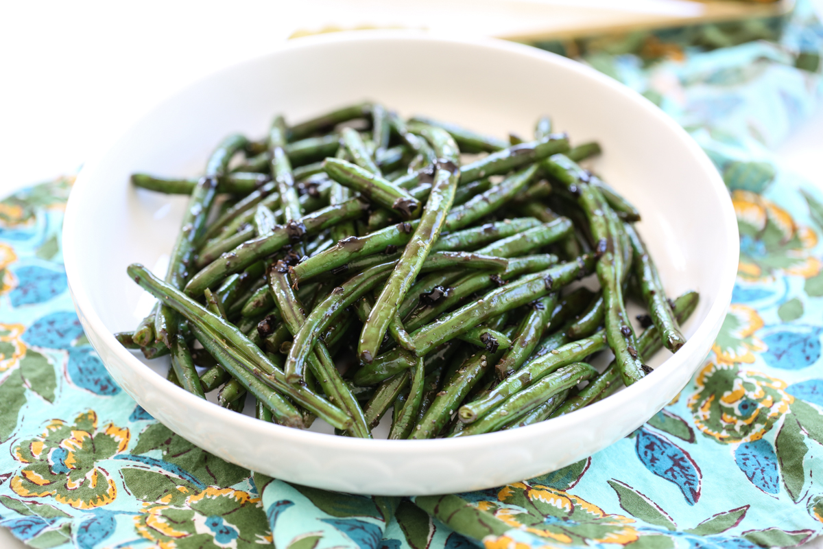 balsamic green beans in a white serving dish