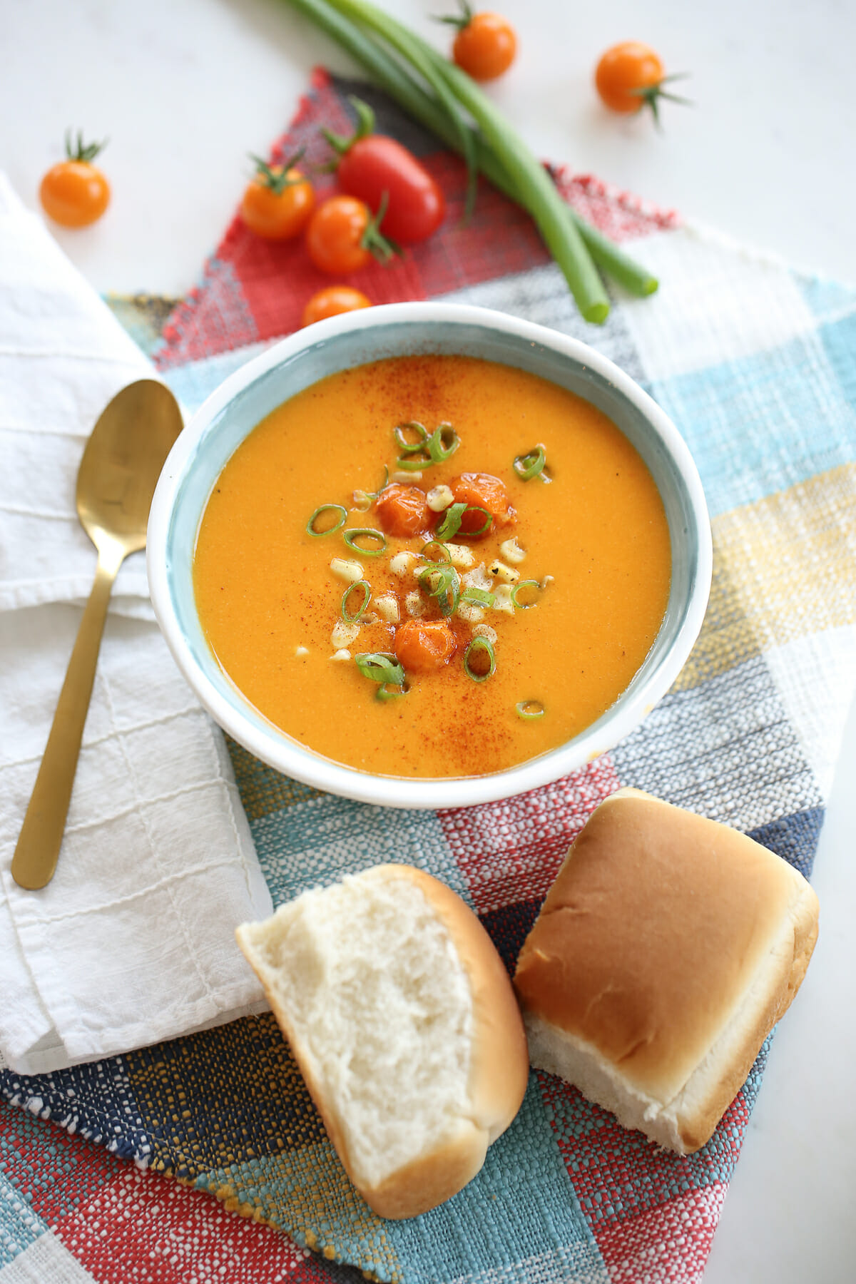 A white bowl filled with tomato soup