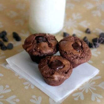 Three chocolate peppermint thumbprint cookies filled with chocolate ganache.