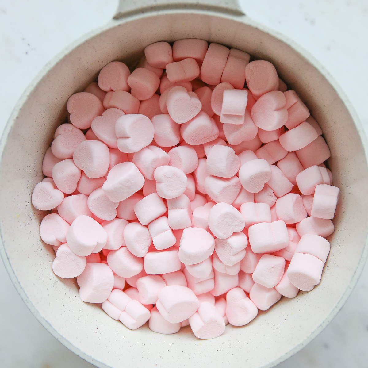 pink heart-shaped marshmallows in a pot