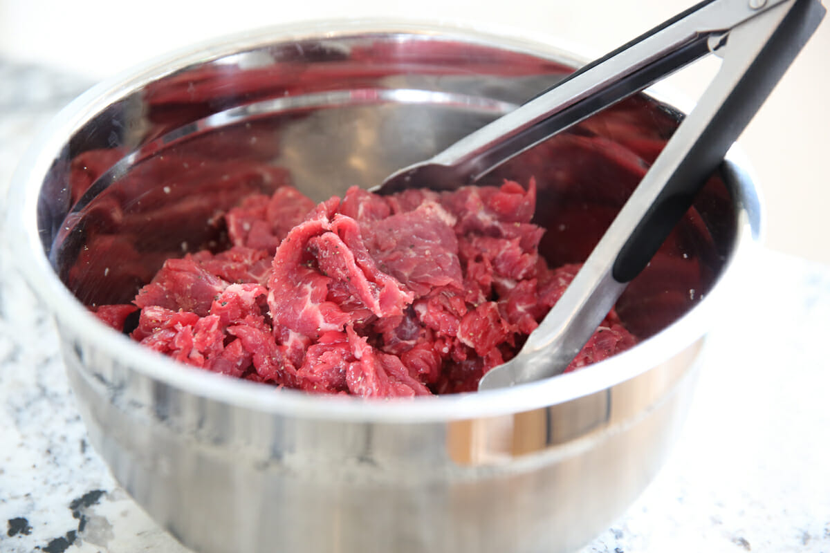 raw sliced steak in bowl