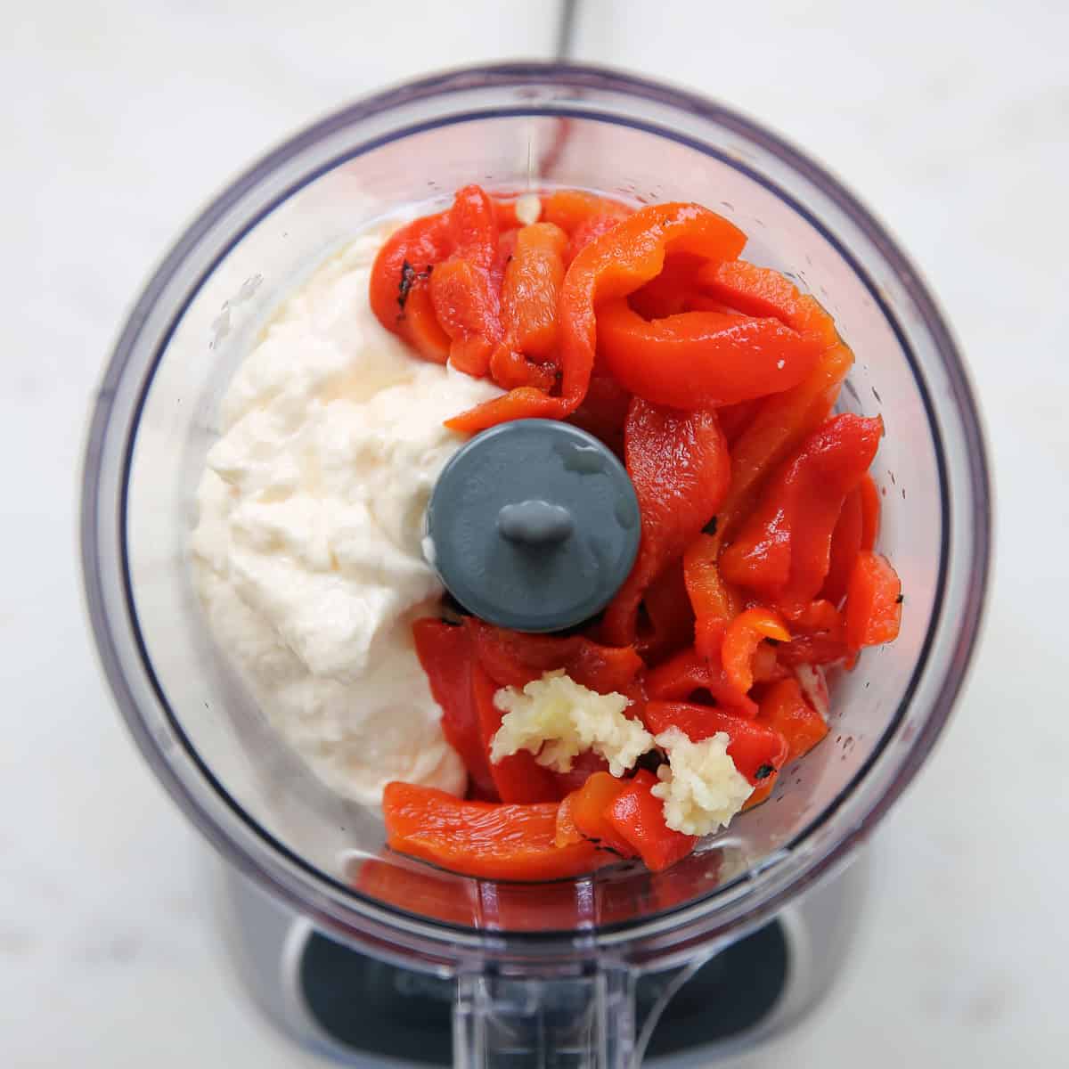 red peppers and mayo in a food processor