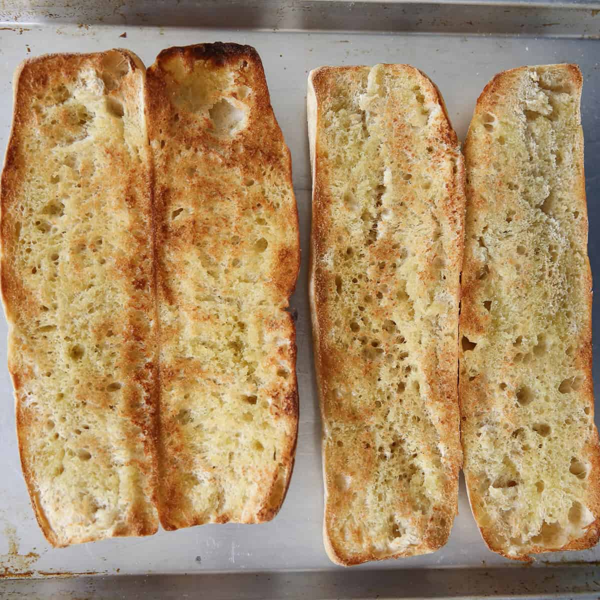 open faced sandwiches on a baking sheet