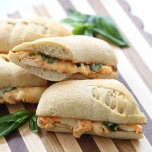 sliced hoagie sandwiches on a cutting board