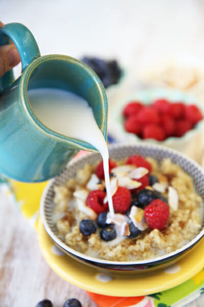 A splash of coconut milk in sweet warm breakfast quinoa