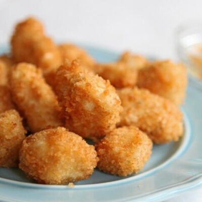 A plate full of homemade chicken nuggets.