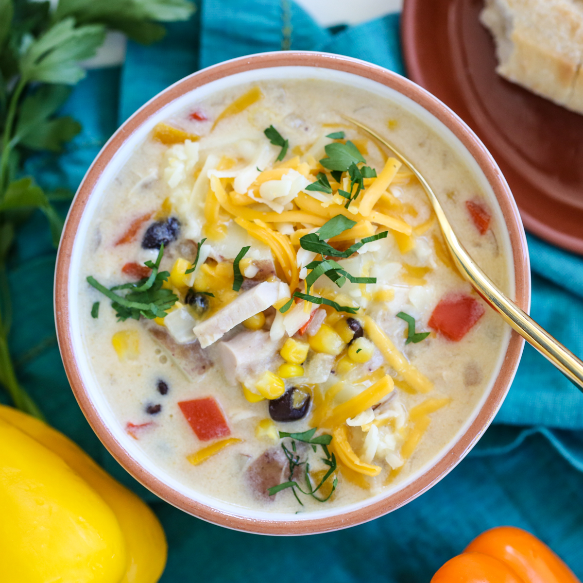 creamy chicken soup in a bowl with mexican toppings
