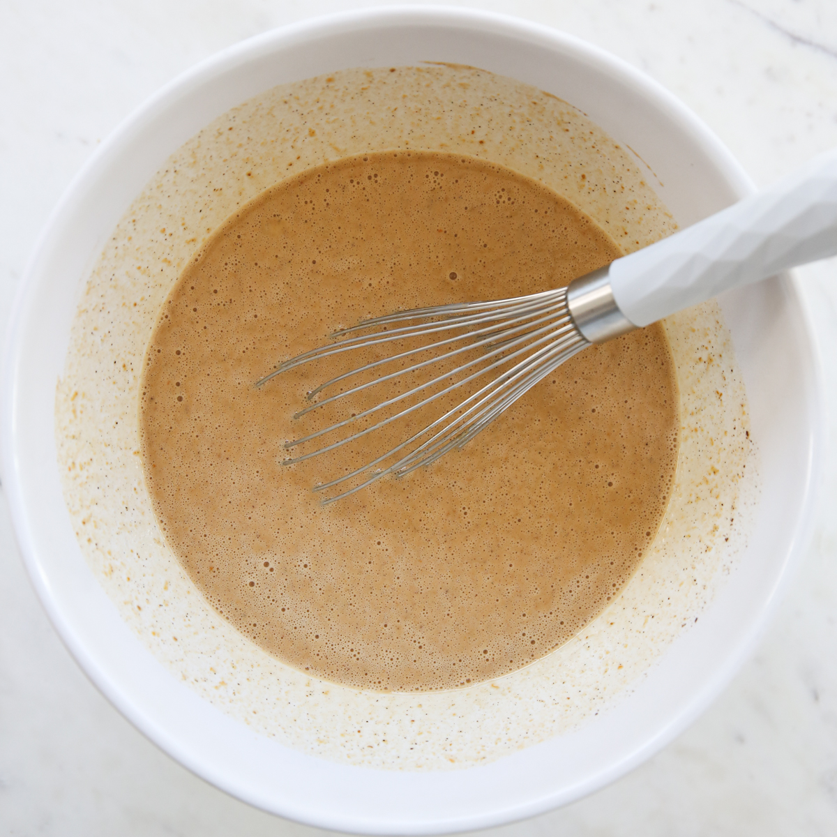 whisked pumpkin custard in a bowl