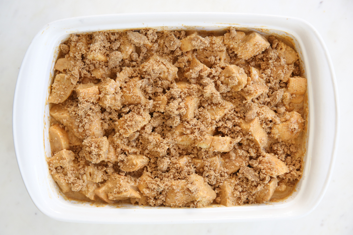 overnight pumpkin french toast in a pan with streusel