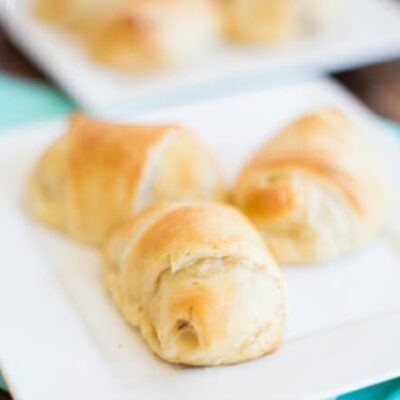 3 Pigs in a Blanket on a white plate.