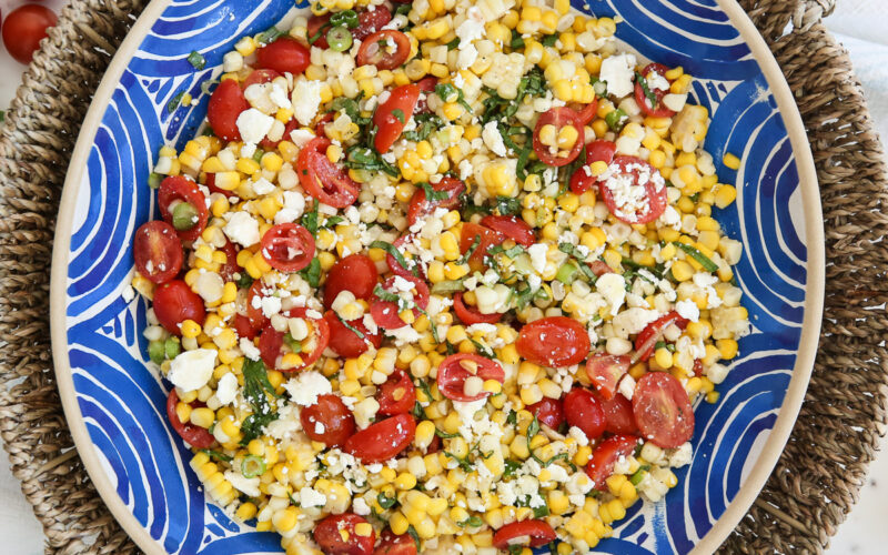 Fresh corn salad in a blue bowl
