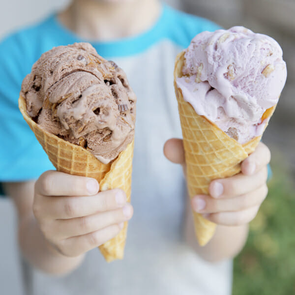 holding ice cream cones