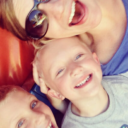 Me with a couple of my kiddos on a tilt-a-whirl mid-ride!