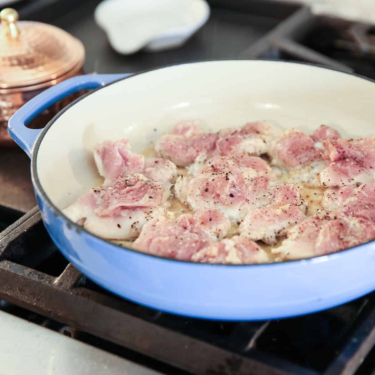 raw chicken in a pan