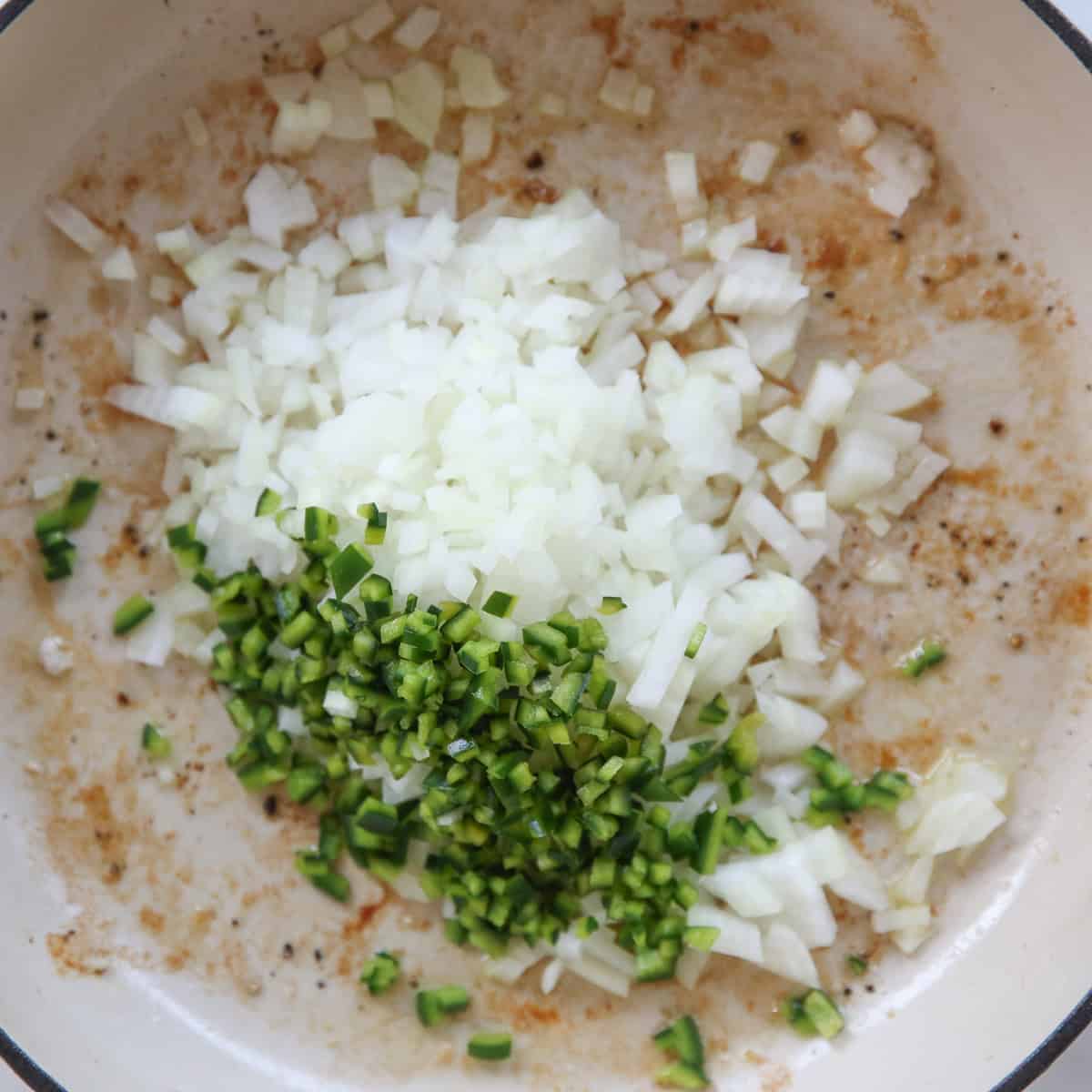 diced onion and peppers in a skillet