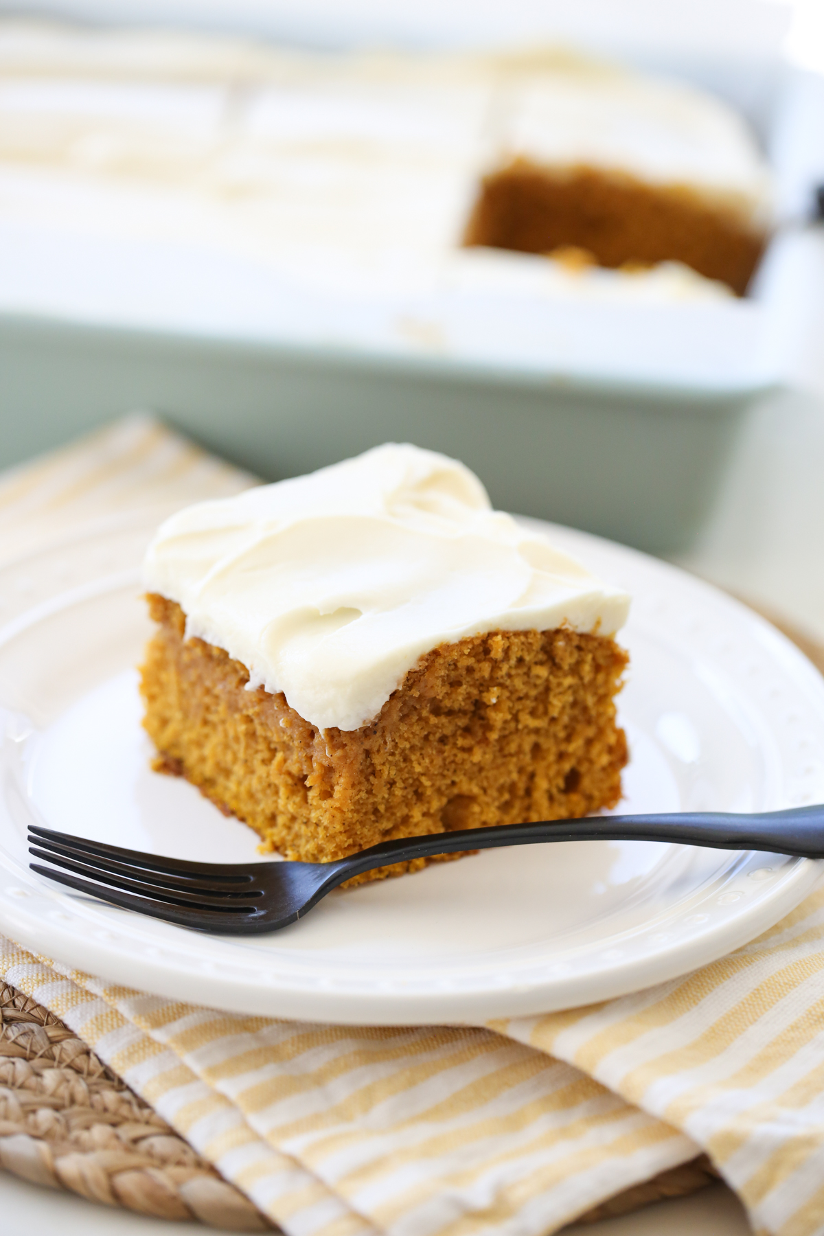 Pumpkin Cake with Cream Cheese Frosting on a plate