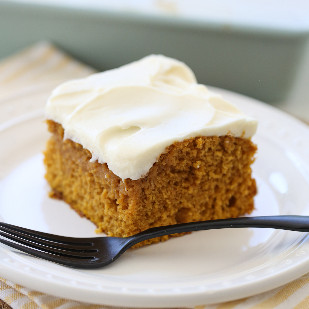 Pumpkin Snack Cake with Cream Cheese Frosting on a plate