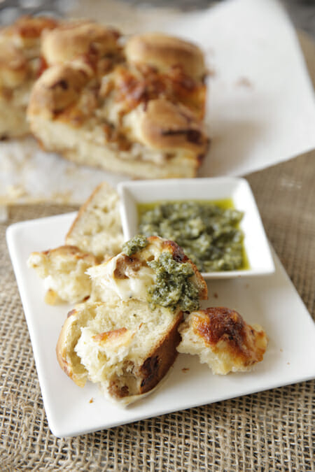 Baked Cheesy Pizza Bread with Pesto from Our Best Bites