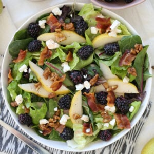 blackberry pear salad in a white bowl