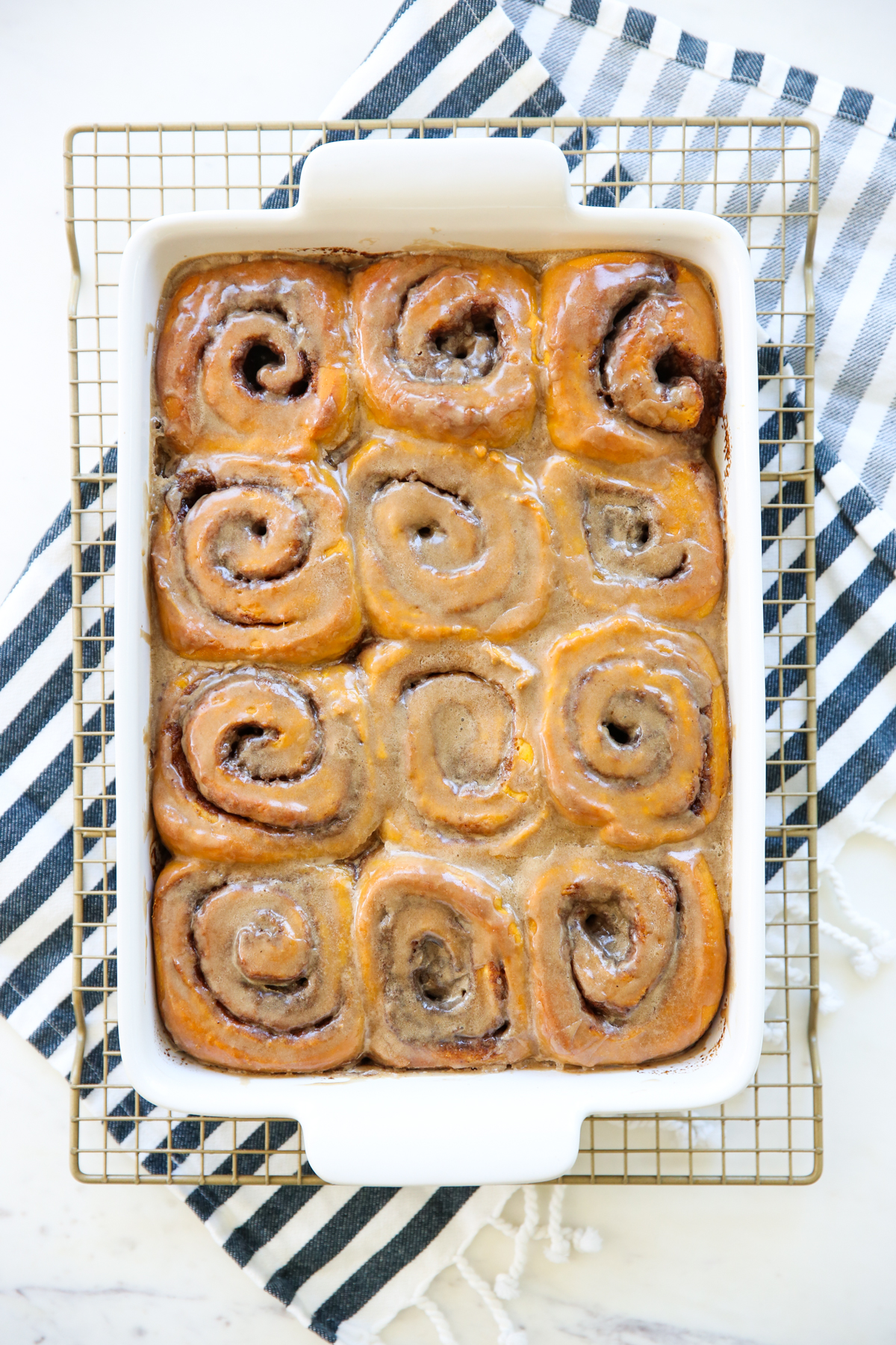 white baking dish of cinnamon rolls