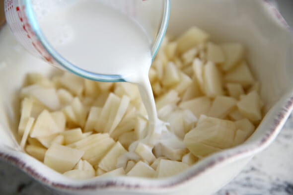 Our Best Bites Pouring Milk in Potatoes