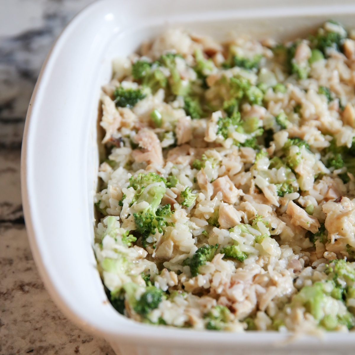 broccoli and cheese casserole in a pan before baking