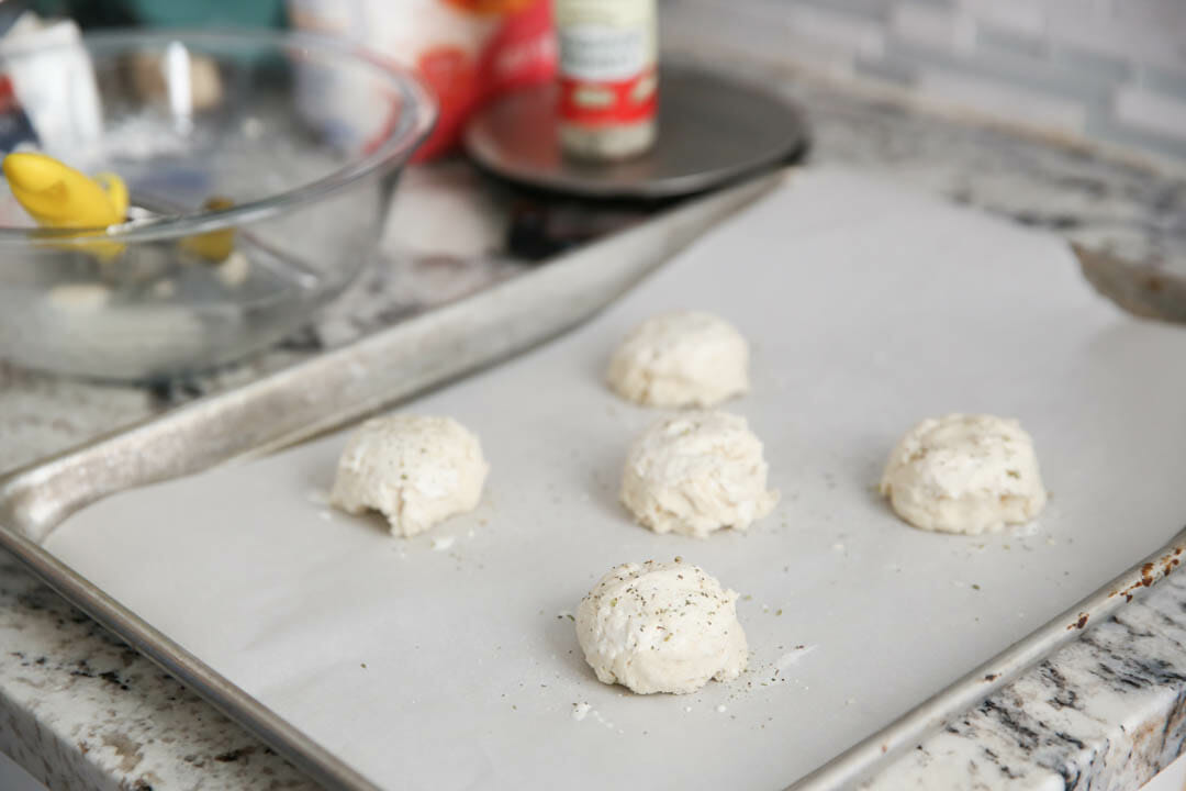 uncooked biscuits on baking sheet