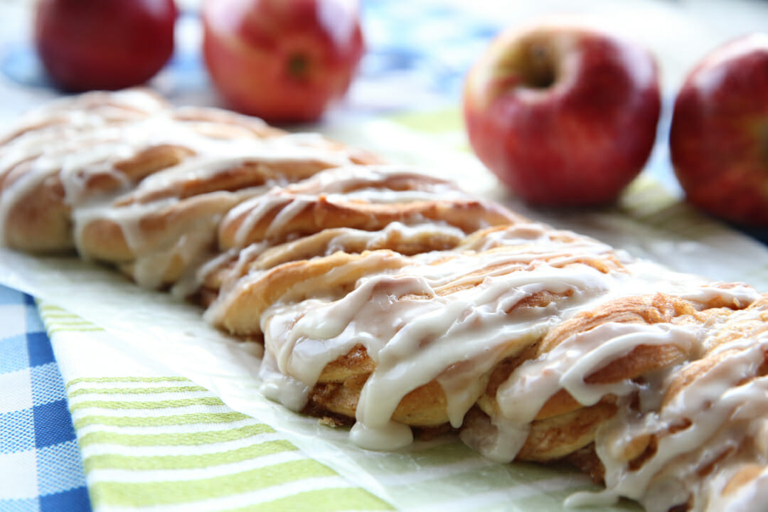 Cinnamon-Apple Twist Bread on wax paper on a table